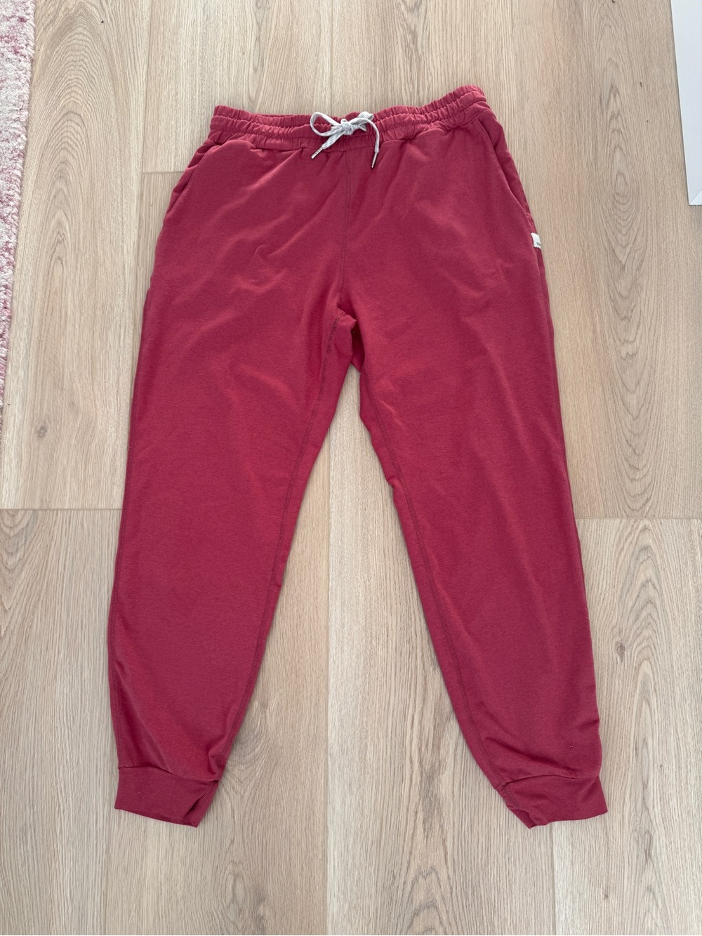 Vuori women's Performance Joggers in a berry red color S